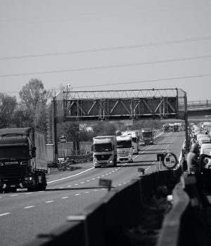 grayscale photo of cars on road